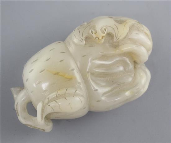 A Chinese pale grey and russet jade carving of a finger citron, 6.8cm